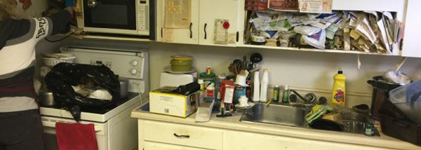 Cluttered kitchen area image two